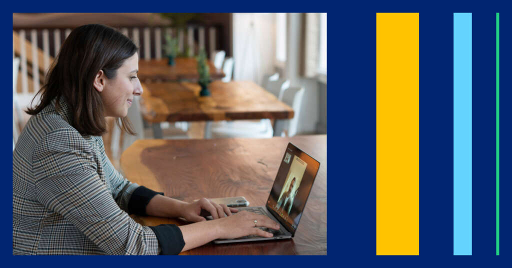 Decorative image of a woman sitting at a desk and typing on a laptop